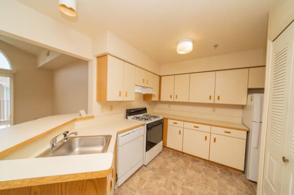 Spacious Kitchen with Breakfast Bar at Canal 2 Apartments, Lansing