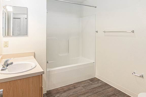 A bathroom with a sink and bathtub/shower at Limestone Creek Apartment Homes, Madison, AL