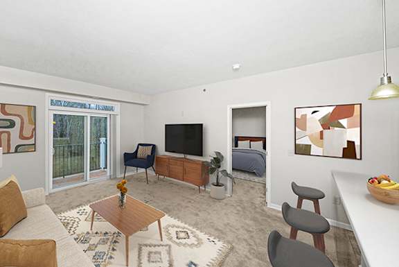 living room with a 9 foot ceiling to a private balcony at Limestone Creek Apartment Homes, Madison, Alabama, 35756
