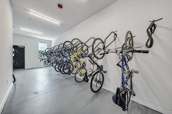 A bike rack with many bikes on it