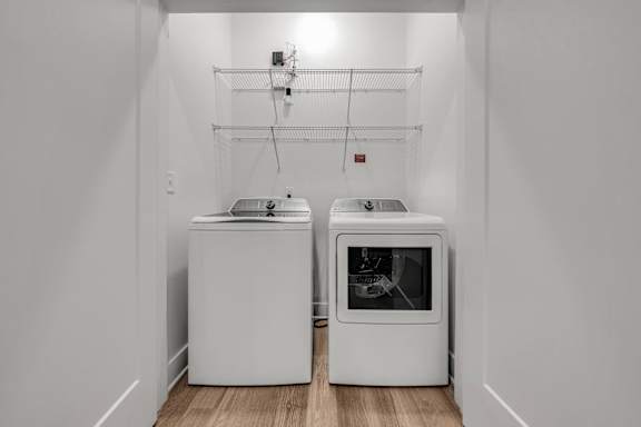 A white kitchen with a dishwasher and an oven at Luxe 360 on Centerpointe Apartments, Midlothian, 23114