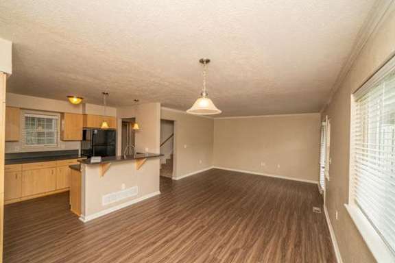 living room and kitchen with a vinyl plank floor at Lynbrook Apartments and Townhomes in Elkhorn, NE