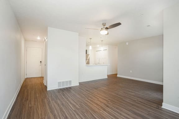 an empty living room with a ceiling fan at Meadowbrooke Apartment Homes, Grand Rapids, 49512