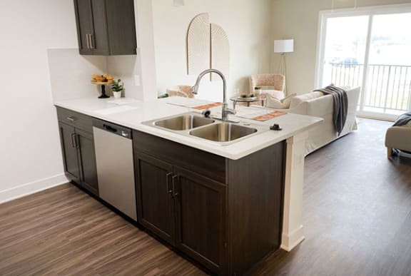 a kitchen with hard surface flooring at Meadowbrooke Apartment Homes in Grand Rapids, MI