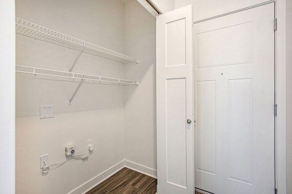 the closet in a bedroom of a home with white doors at Meadowbrooke Apartment Homes, Grand Rapids, Michigan