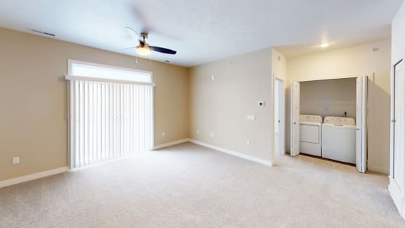 an empty living room with a closet and a laundry room at Meadowbrooke Apartment Homes, Grand Rapids, MI, 49512