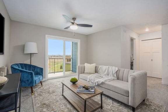 a living room with a couch and a coffee table at Meadowbrooke Apartment Homes, Grand Rapids, 49512
