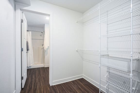a closet in a bedroom with a mirrored closet door at Meadowbrooke Apartment Homes, Grand Rapids