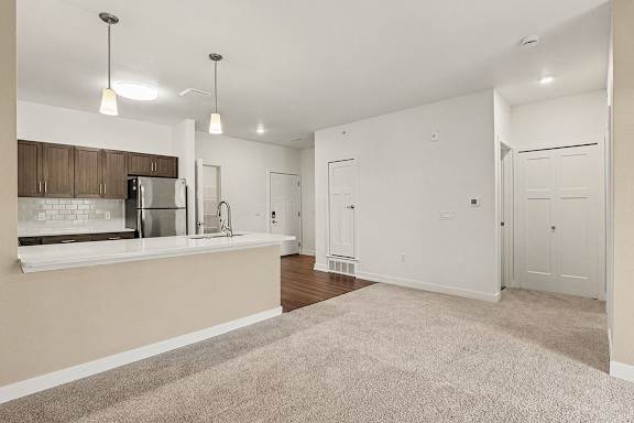 A kitchen with breakfast bar at Meadowbrooke Apartment Homes in Grand Rapids, MI 49512