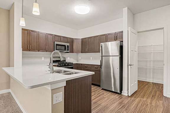 Modern Kitchen with Large Pantry at Meadowbrooke Apartment Homes in Kentwood, MI 49512