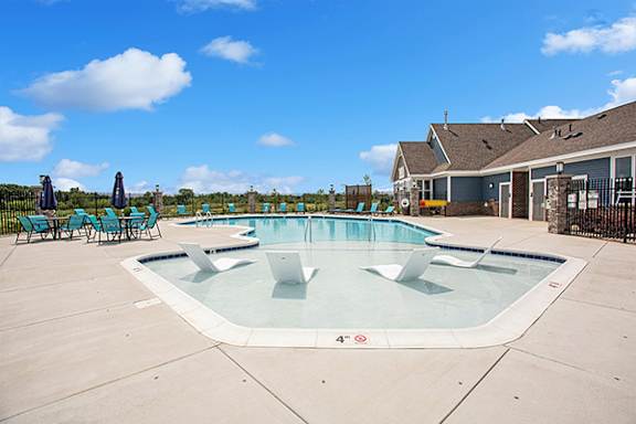 Refreshing Pool with Pergola, fire pit, and grilling area at Meadowbrooke Apartment Homes, Grand Rapids