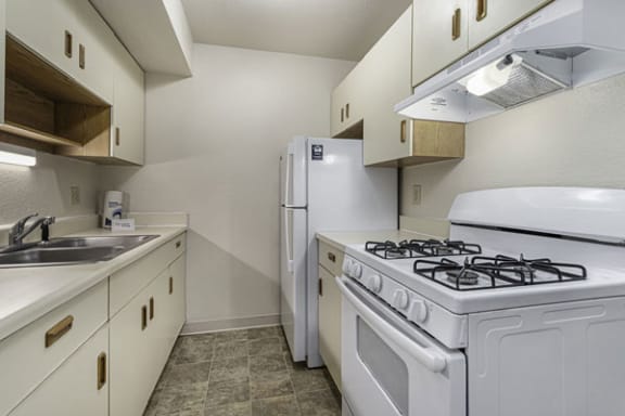 Galley-Style Kitchen at Normandy Village Apartments in Michigan City, IN