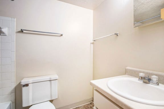 A full bathroom with a bathtub and shower at Normandy Village Apartments, Michigan City, Indiana