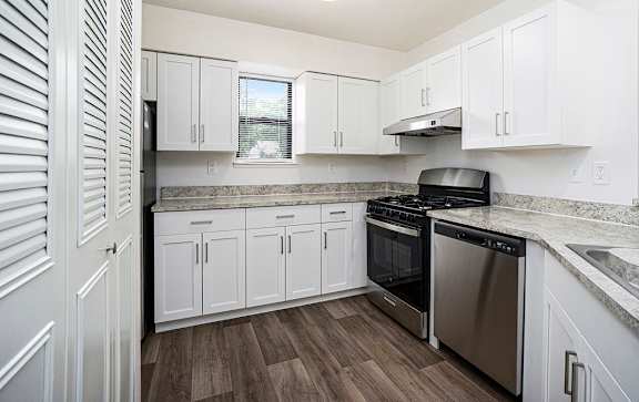 A kitchen with white cabinets at North Pointe Apartments, Elkhart, IN, 46514