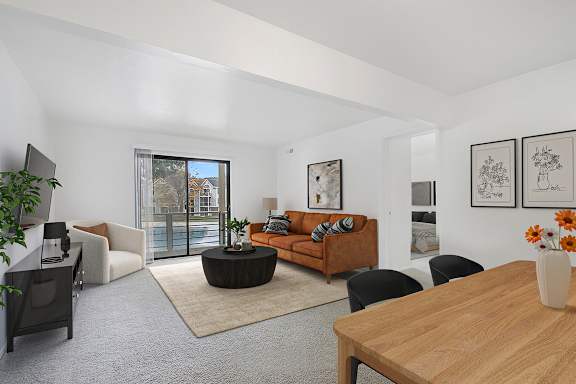 living room and dining room leading to a balcony at North Pointe Apartments, Indiana, 46514