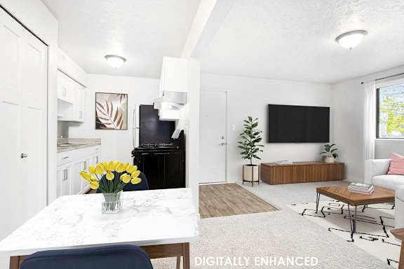 A white kitchen and dining room with a table and chairs at Old Farm Apartments, Elkhart, 46517