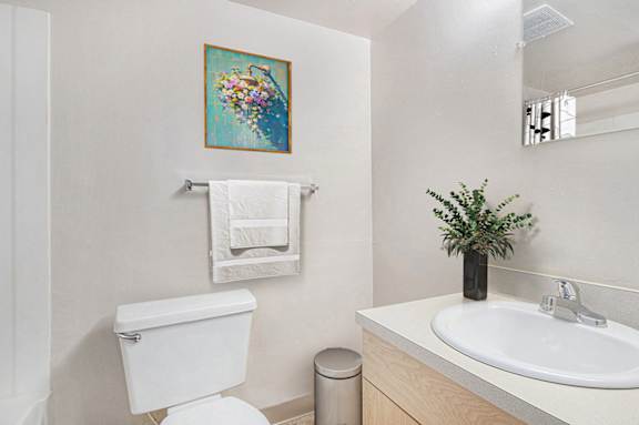 a bathroom with a sink toilet and a mirror at Old Farm Apartments, Elkhart, 46517