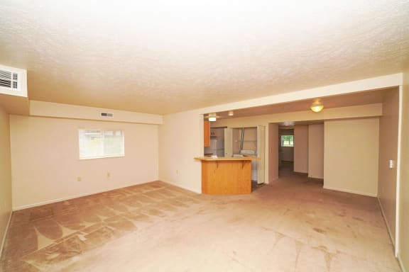 the living room and kitchen of an empty house at Orchard Lakes Apartments, Ohio, 43615