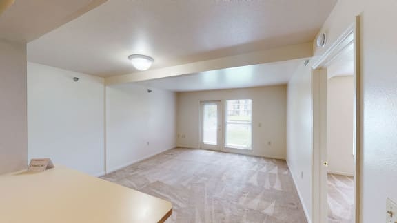 the living room and dining room of an empty apartment at Orchard Lakes Apartments, Toledo, 43615