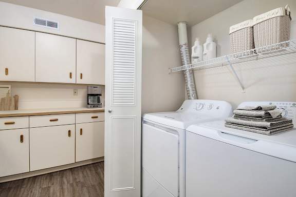 A kitchen laundry area with a washer and dryer at Orchard Lakes Apartments, Toledo, 43615