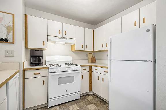 A kitchen with white appliances at Orchard Lakes Apartments, Toledo, 43615