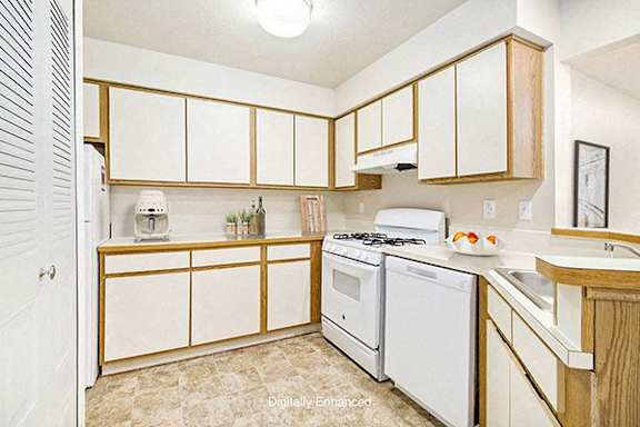 Kitchen with Breakfast Bar at Pine Knoll Apartments in Battle Creek, MI