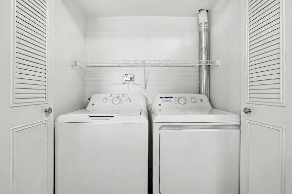 A full size washing machine  and dryer at Pine Knoll Apartments, Battle Creek