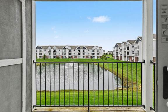 Private balcony with storage and a view at The Reserve at Destination Pointe apartments, Grimes, IA