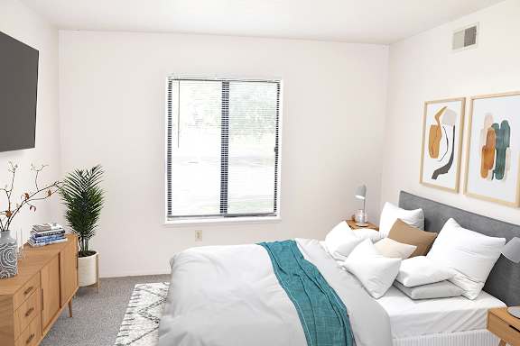 a bedroom with a window at Seville Apartments, Michigan, 49009