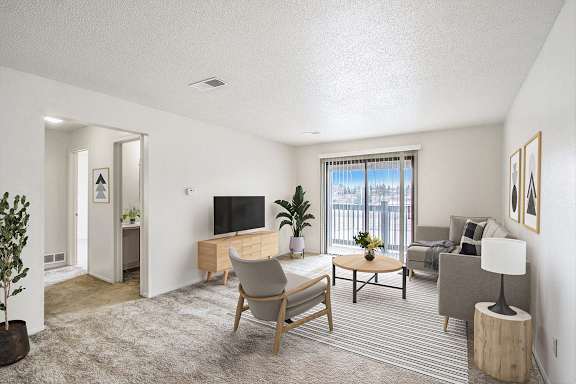 a living room with a slider to a balcony at Seville Apartments, Kalamazoo, MI, 49009