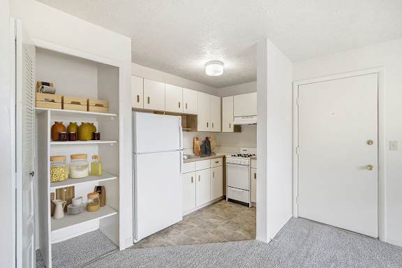 studio kitchen with large closet at Seville Apartments in Kalamazoo, MI 49009