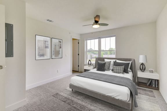 a bedroom with a bed and a ceiling fan  at Signature Pointe Apartment Homes, Athens, AL, 35611