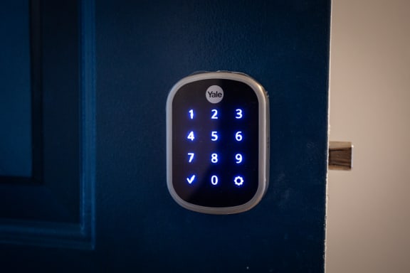 a blue door handle with a digital clock on it  at LakePointe Apartments, Batavia, Ohio