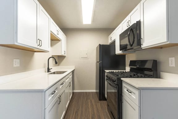 soft white quartz countertops at Cordoba Apartments, Farmington Hills, MI