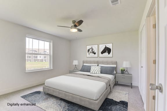 a bedroom with a bed and a ceiling fan at Stoney Pointe Apartment Homes, Wichita, 67226