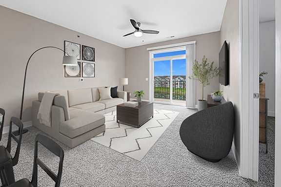 A living room with a 9' ceiling, a grey sofa, an armchair, and a coffee table at Strathmore Apartment Homes in West Des Moines, IA