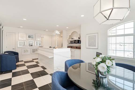 A black and white checkered floor in a well lit room.