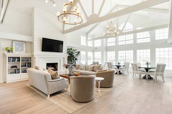 A living room with a fireplace and a television.