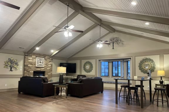 community building with a high ceiling and fireplace at Tanglewood Apartments, Oak Creek, WI, 53154