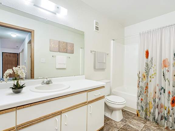 A spacious bathroom with a large vanity  at Tanglewood Apartments, Oak Creek, WI