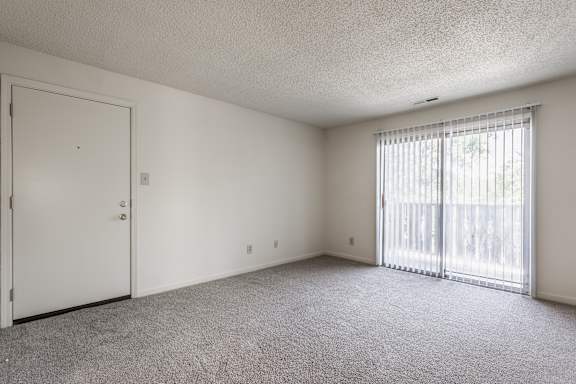 living room with door to balcony at The Timbers Apartments, Evansville, Indiana