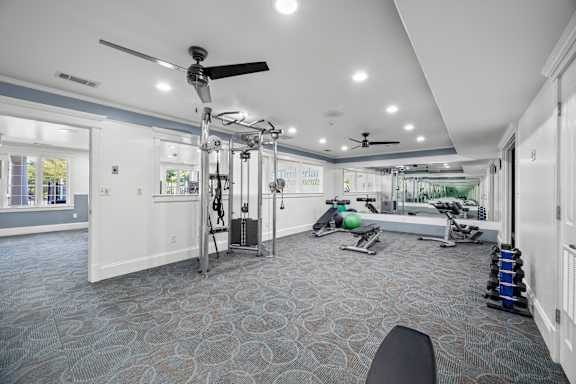 A spacious gym with a variety of exercise equipment