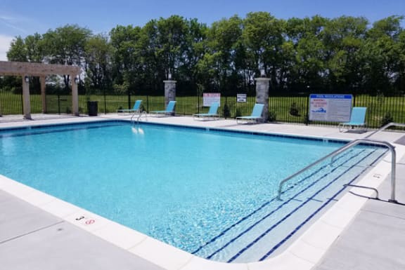 Swimming Pool with Large Sundeck at Trade Winds Apartment Homes in Elkhorn, NE