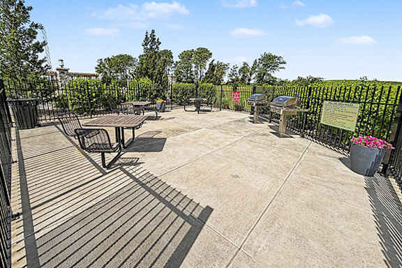 Grilling Area with Seating at Trade Winds Apartment Homes in Elkhorn, NE