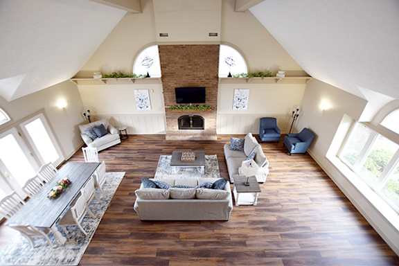 Community Building with High Ceiling at Trappers Cove Apartments in Lansing, MI