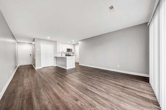 Living Room With Oversized Windows And Doors at WaterFront Apartments, Virginia