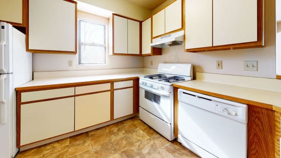 a kitchen with a window at Windmill Lakes Apartments, Holland, 49424