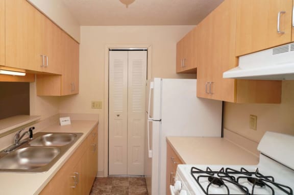 kitchen with a breakfast bar and pantry  at Wood Creek Apartments, Kenosha