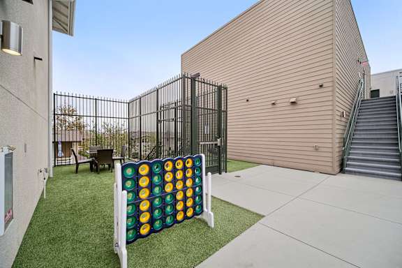 A large outdoor Connect Four game set up on a lawn.