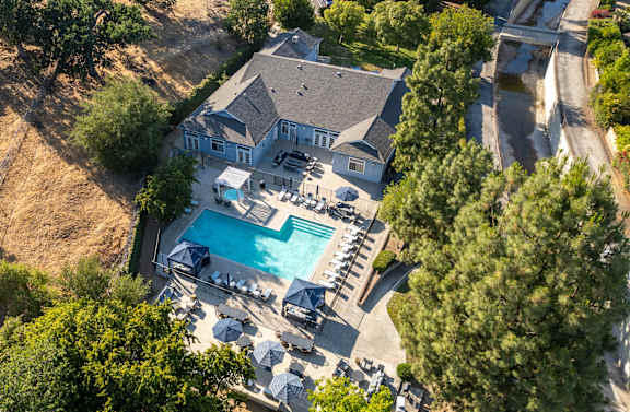 A large house with a pool and a deck.